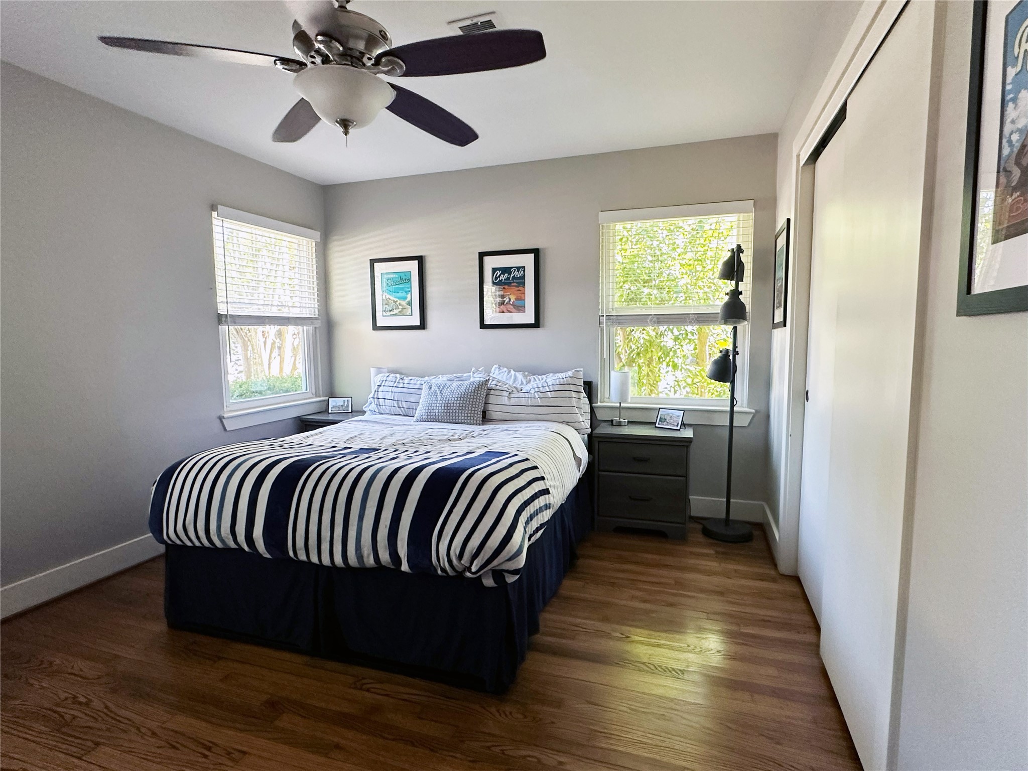 4821 Hummingbird Street Houston, TX 77035 - Photo 25 of 45 a bedroom with a bed and wooden floor