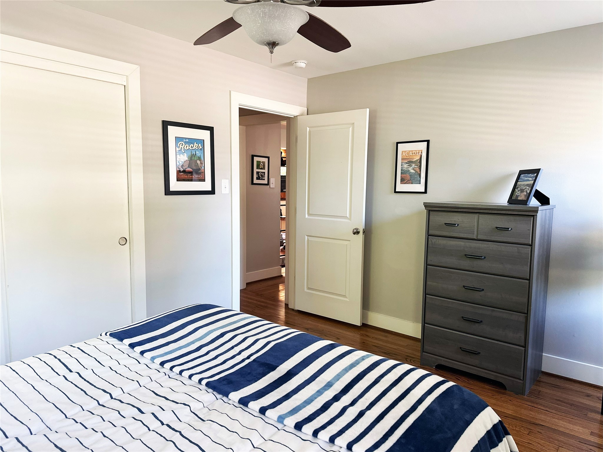 4821 Hummingbird Street Houston, TX 77035 - Photo 27 of 45 a bedroom with a bed and a dresser