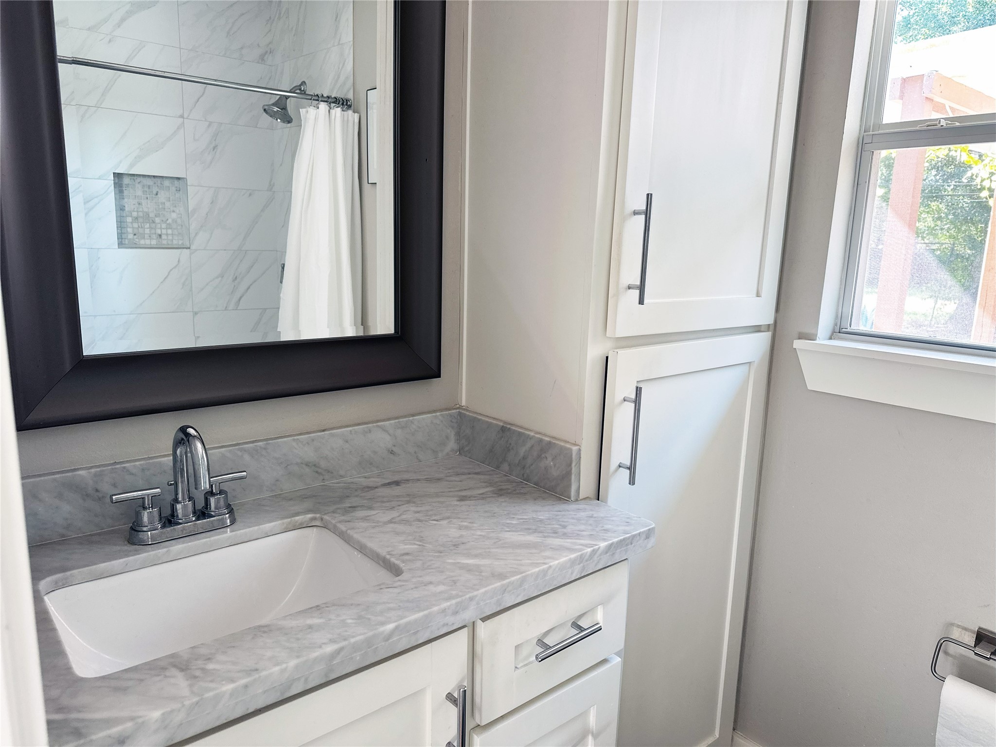 4821 Hummingbird Street Houston, TX 77035 - Photo 36 of 45 a bathroom with a granite countertop sink and a mirror