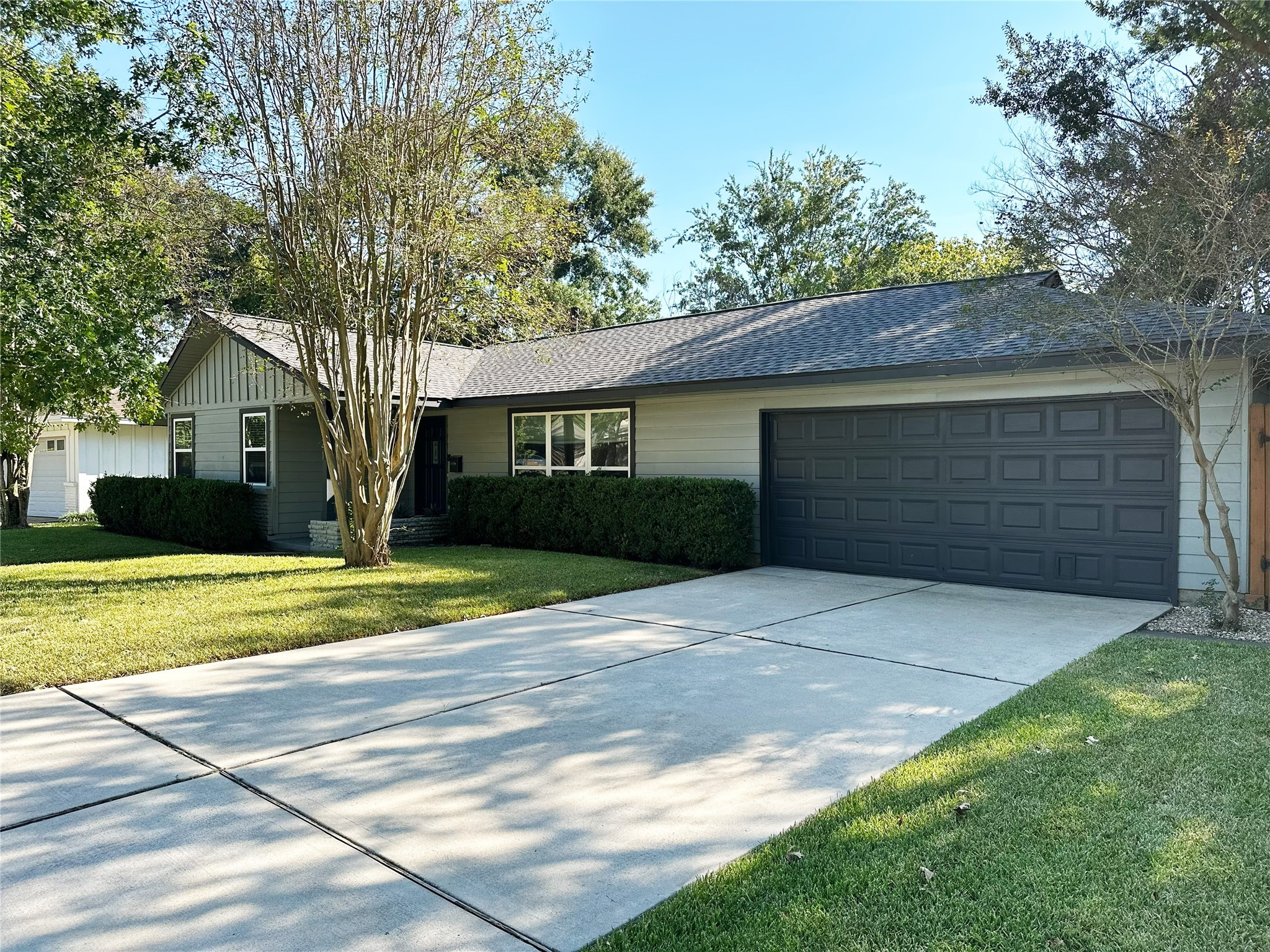 4821 Hummingbird Street Houston, TX 77035 - Photo 4 of 45 a front view of a house with a yard and garage