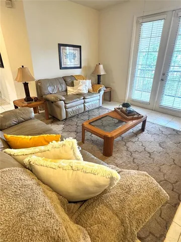 a living room with furniture and a table