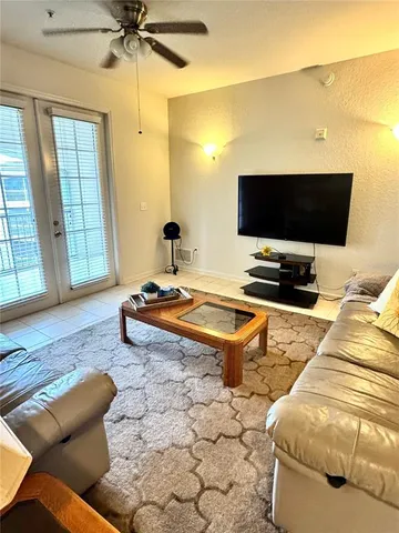a living room with furniture and a flat screen tv