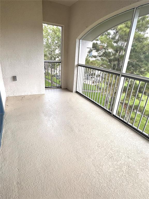 3051 Greystone Loop, Unit 306 Kissimmee, FL 34741 - Photo 16 of 27 a view of a room with sliding window