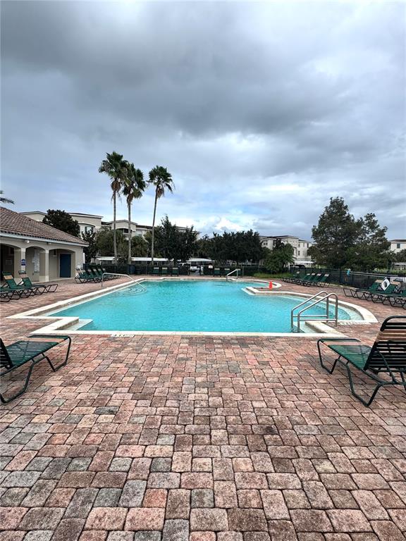 3051 Greystone Loop, Unit 306 Kissimmee, FL 34741 - Photo 25 of 27 a view of swimming pool in a yard