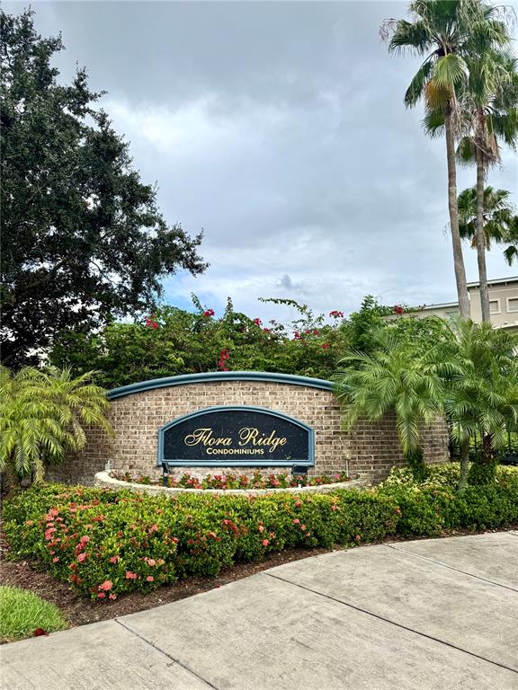 3051 Greystone Loop, Unit 306 Kissimmee, FL 34741 - Photo 3 of 27 a sign on the side of a building