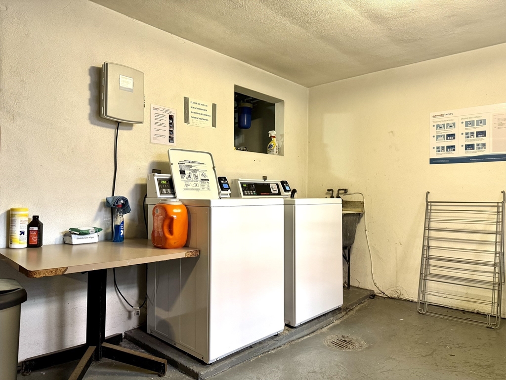 206 High Street, Unit 7 Waltham, MA 02453 - Photo 12 of 17 a utility room with multiple dryer and washer