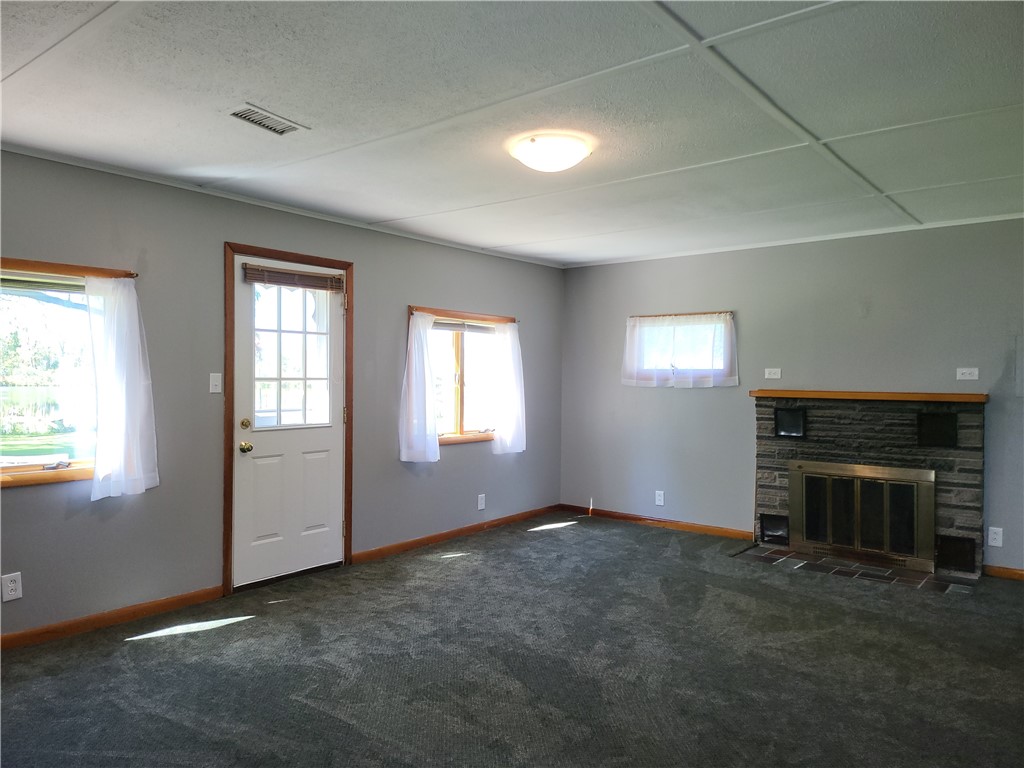 52 Blue Pond Manor Wheatland, NY 14546 - Photo 8 of 27 Living Room w/ Door To The Deck & Water!