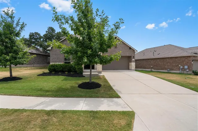 a house view with a garden space