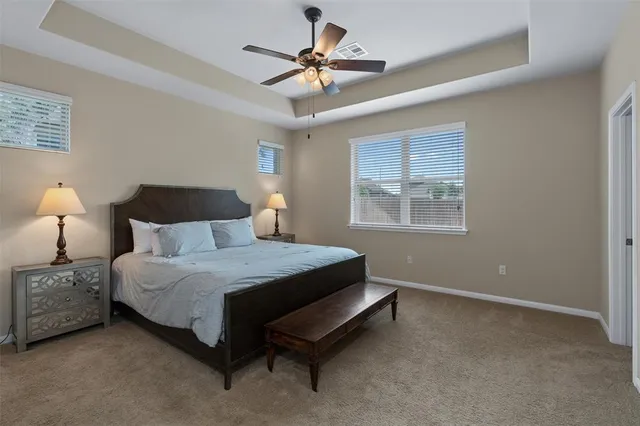 a bedroom with a bed and window