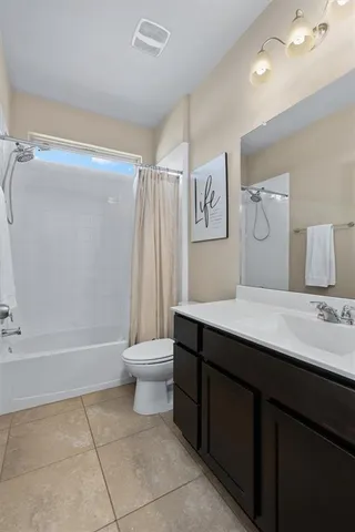 a bathroom with a sink a toilet and a bathtub