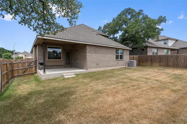 a house with trees in the background