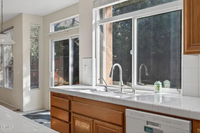 a bathroom with double vanity sinks and a mirror