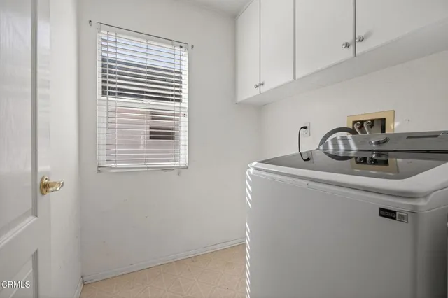 a close view of sink a washer and dryer