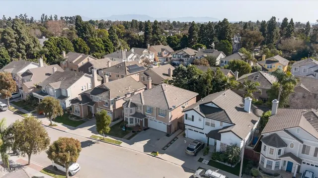 an aerial view of a house with lots of trees
