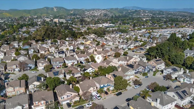 an aerial view of a city with lots of residential buildings