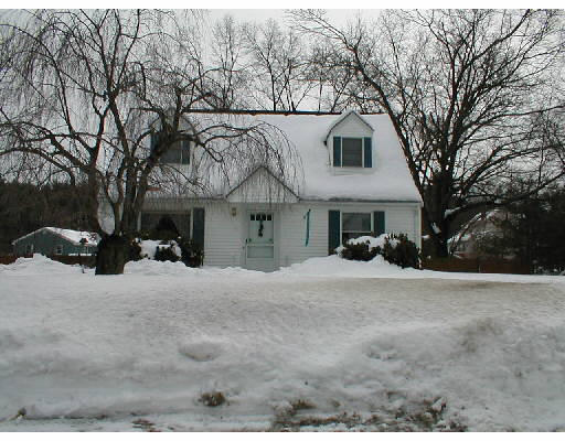 107 Salem Road Billerica, MA 01821 - Photo 1 of 1 a view of a house with a yard covered in snow