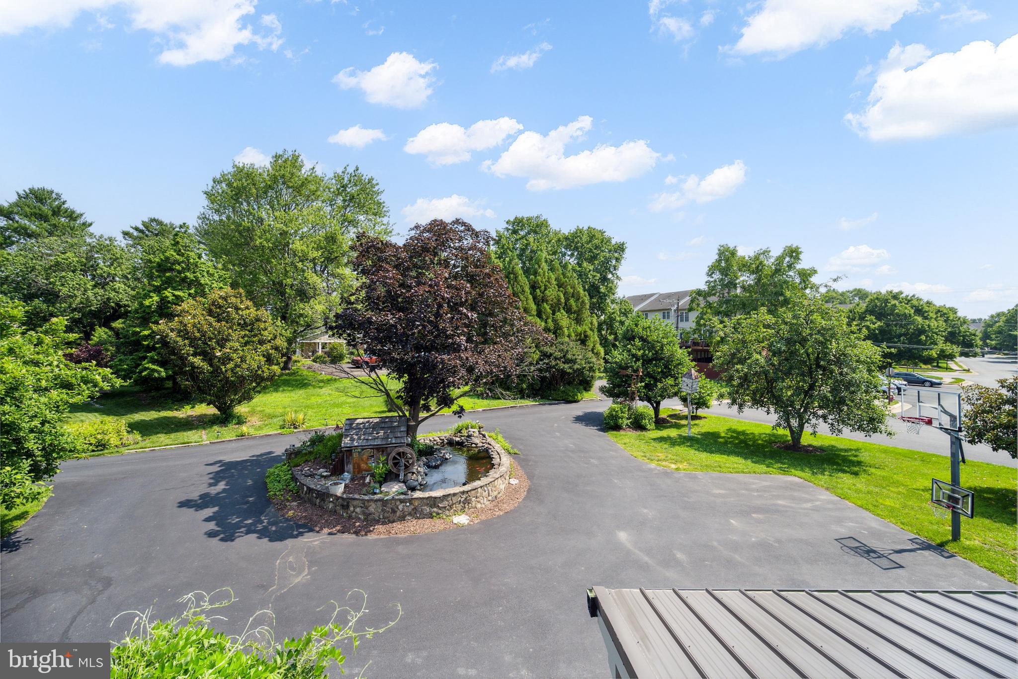 131 Ken Culbert Jr. Road Purcellville, VA 20132 - Photo 42 of 75 driveway with Koi pond