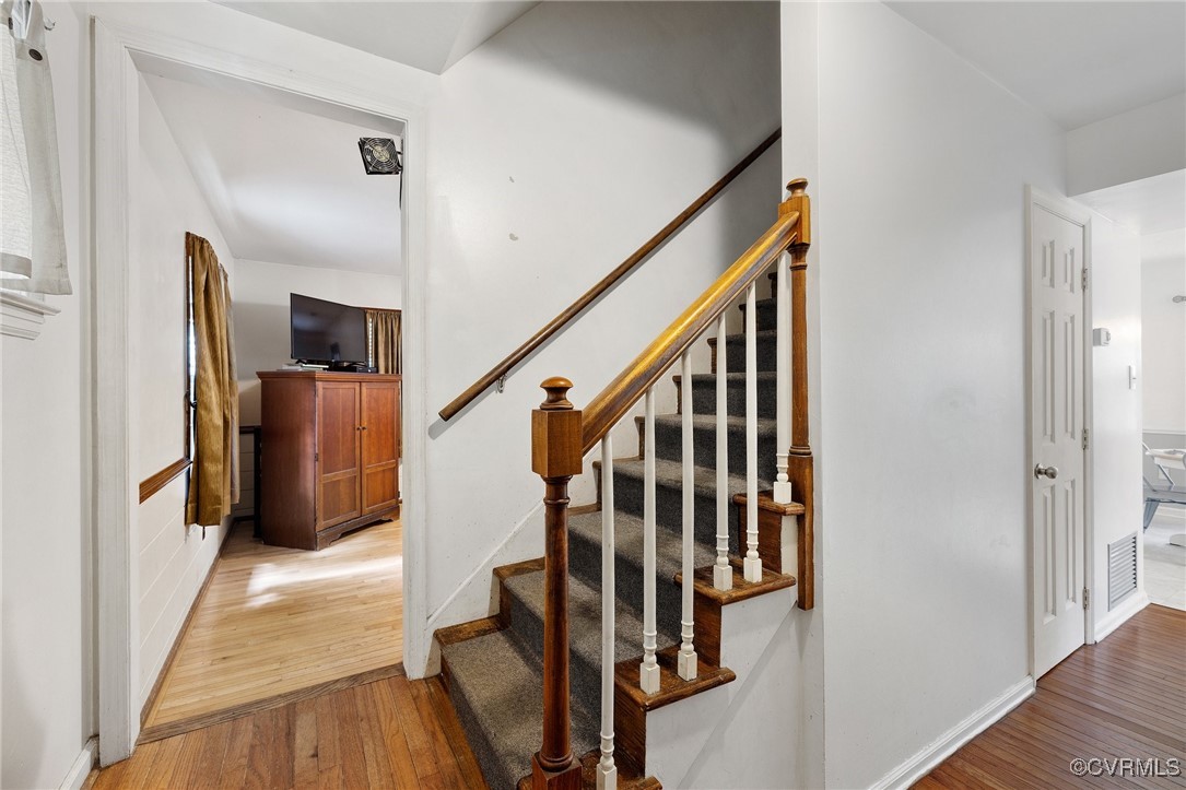 1908 Early Settlers Road Richmond, VA 23235 - Photo 2 of 25 a view of entryway with stairs and wooden floor
