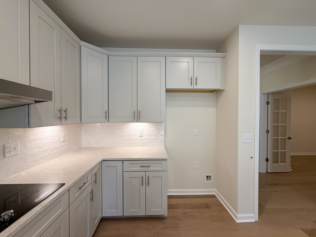 6 Stratton Drive, Unit 110 Woburn, MA 01801 - Photo 11 of 26 a kitchen with a sink and cabinets