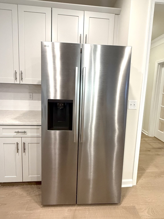 6 Stratton Drive, Unit 110 Woburn, MA 01801 - Photo 12 of 26 a view of a refrigerator in kitchen with stainless steel appliances granite countertop a refrigerator and a sink