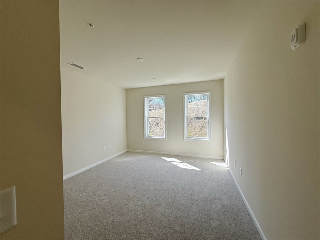 6 Stratton Drive, Unit 110 Woburn, MA 01801 - Photo 15 of 26 a view of an empty room with a window
