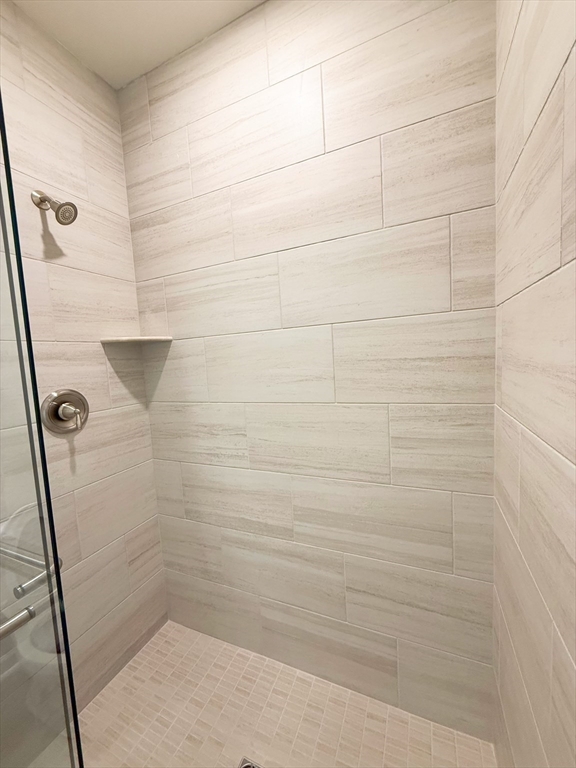 6 Stratton Drive, Unit 110 Woburn, MA 01801 - Photo 19 of 26 a bathroom with a shower