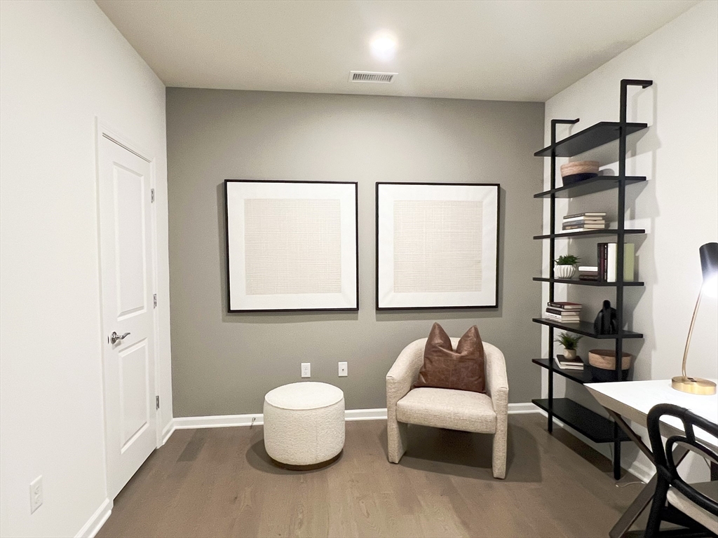 6 Stratton Drive, Unit 110 Woburn, MA 01801 - Photo 22 of 26 a bedroom with furniture and a large window