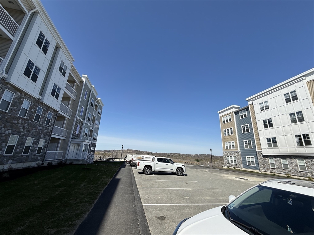 6 Stratton Drive, Unit 110 Woburn, MA 01801 - Photo 23 of 26 a view of building with yard and street view
