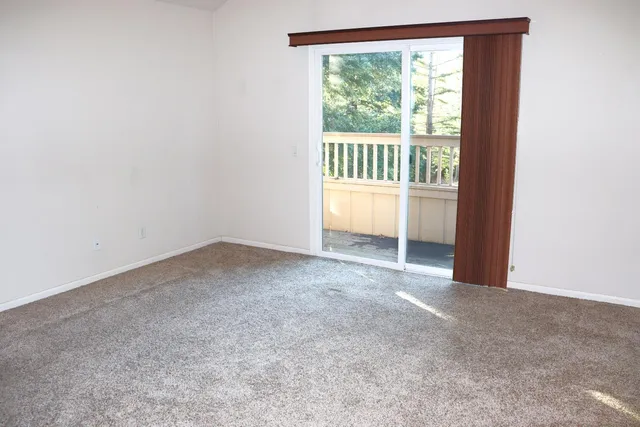 a view of a room with a large window