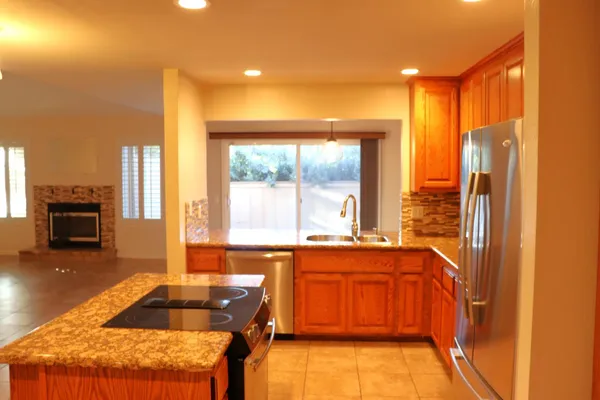 a kitchen with a sink and a refrigerator