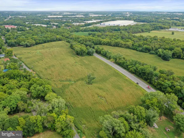 a view of a green field with an outdoor space