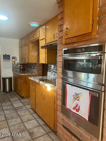 6830 North Frontier Road McNeal, AZ 85617 - Photo 23 of 51 a kitchen with stainless steel appliances granite countertop a stove a sink and a microwave
