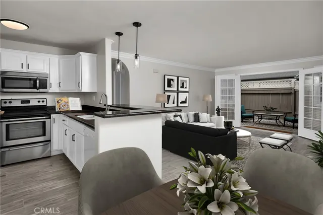 a living room with furniture appliances and a flat screen tv