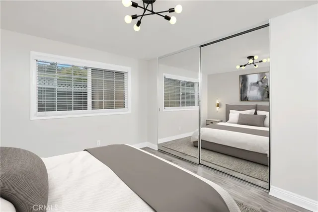 a bedroom with a bed and glass window