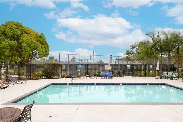 a view of a swimming pool with a patio