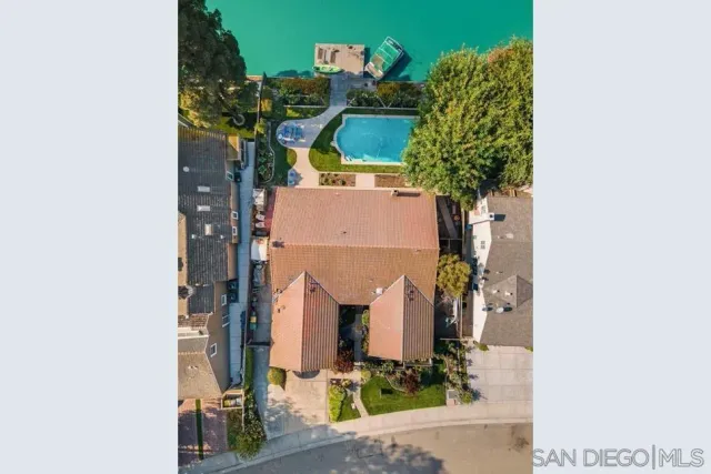 an aerial view of a house with a garden
