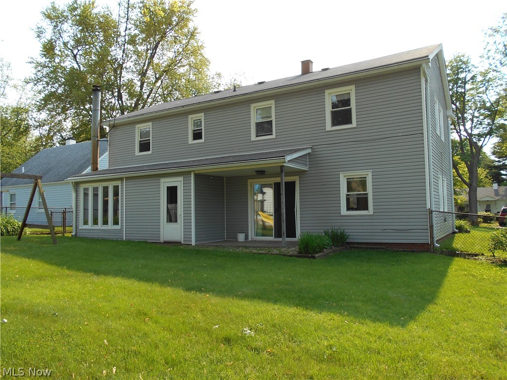 1821 Aberdeen Road Madison, OH 44057 - Photo 4 of 26 Rear view of housed with fenced in yard