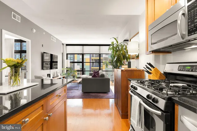 a kitchen with stainless steel appliances granite countertop a stove and a sink