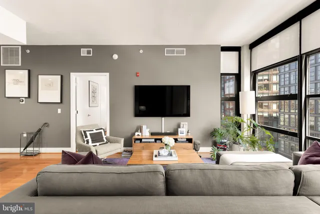 a living room with furniture and a flat screen tv