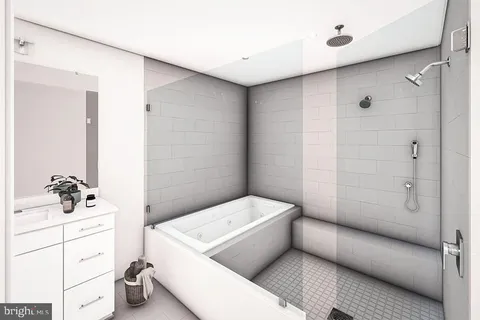 a bathroom with a bathtub and shower