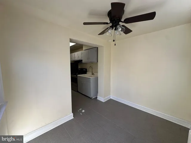 a view of a kitchen with a sink and cabinets