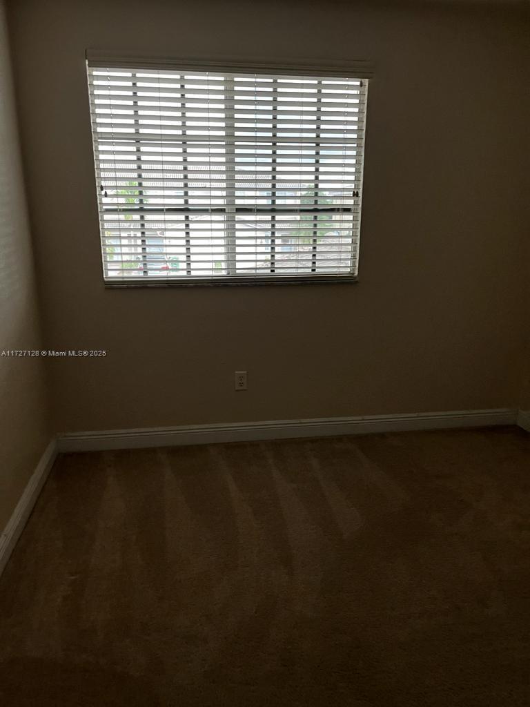 5923 Abbey Road Tamarac, FL 33321 - Photo 14 of 37 a view of an empty room with a window