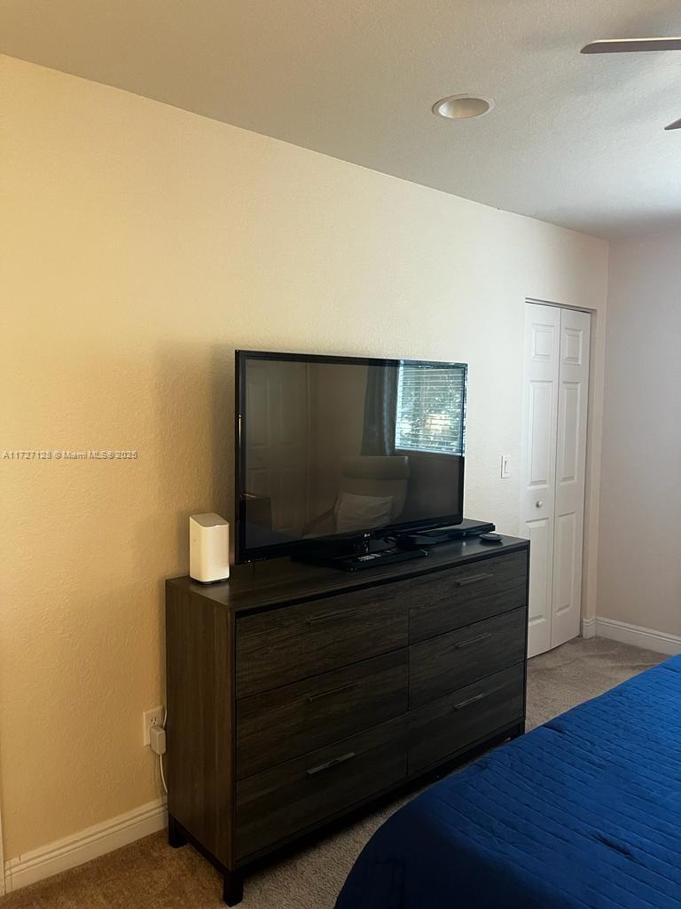 5923 Abbey Road Tamarac, FL 33321 - Photo 16 of 37 a living room with furniture and flat screen tv
