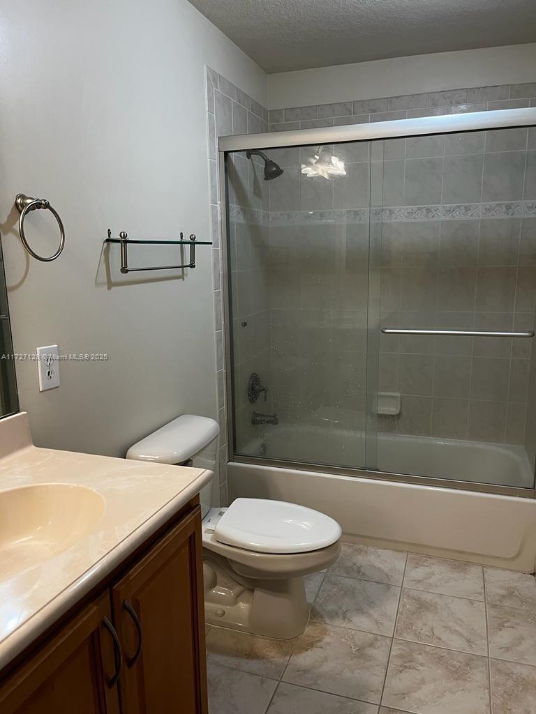 5923 Abbey Road Tamarac, FL 33321 - Photo 21 of 37 a bathroom with a sink a toilet and shower
