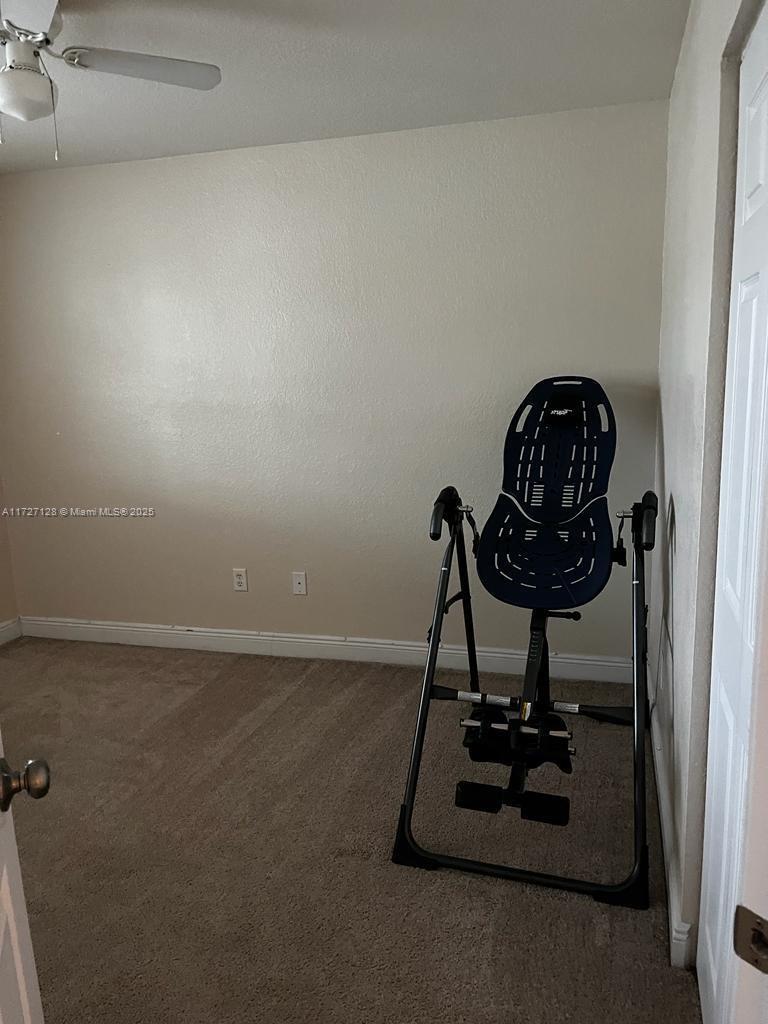5923 Abbey Road Tamarac, FL 33321 - Photo 25 of 37 a view of a room with gym equipment