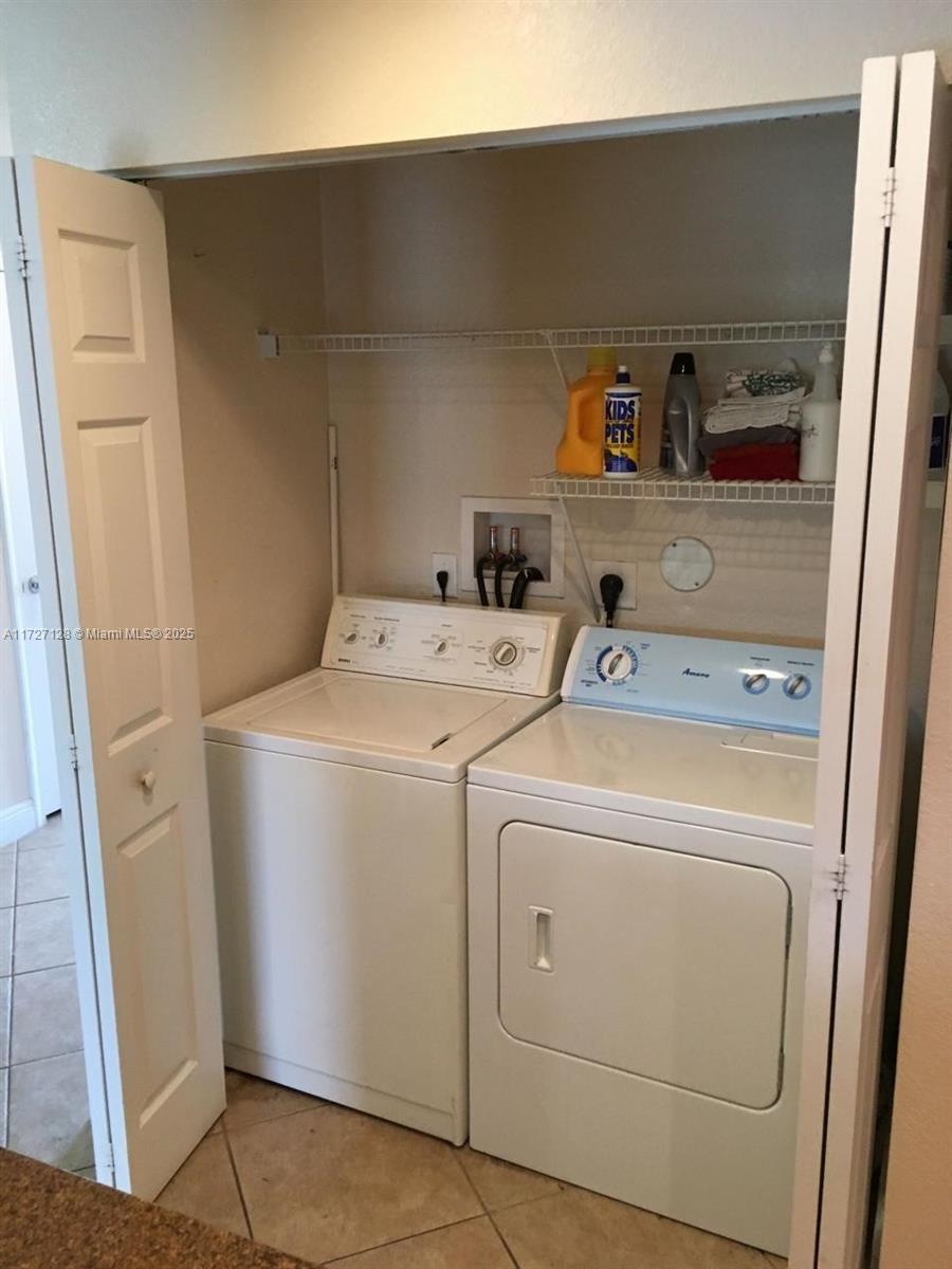 5923 Abbey Road Tamarac, FL 33321 - Photo 26 of 37 a utility room with dryer and washer