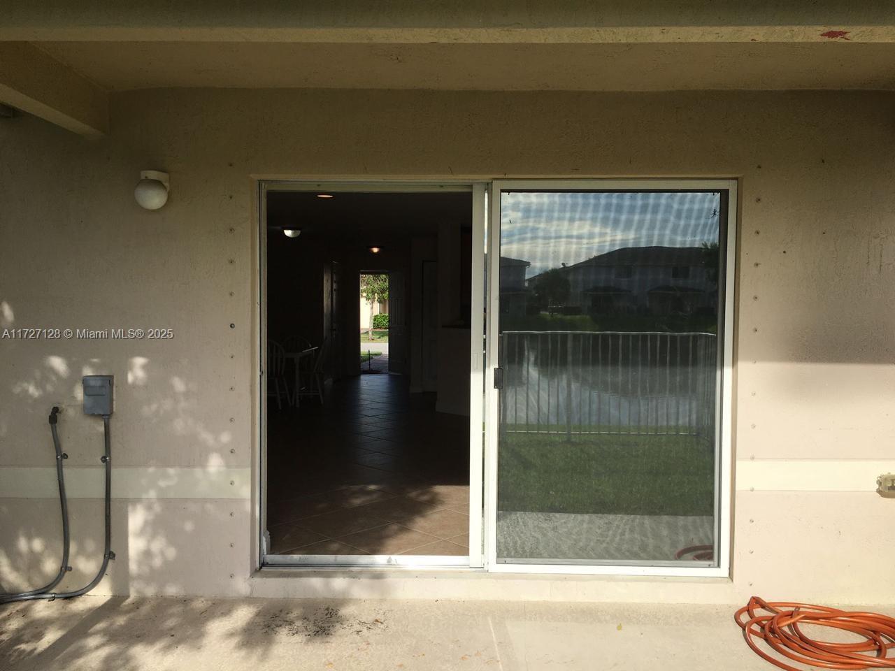 5923 Abbey Road Tamarac, FL 33321 - Photo 28 of 37 a view of a bathroom from a hallway