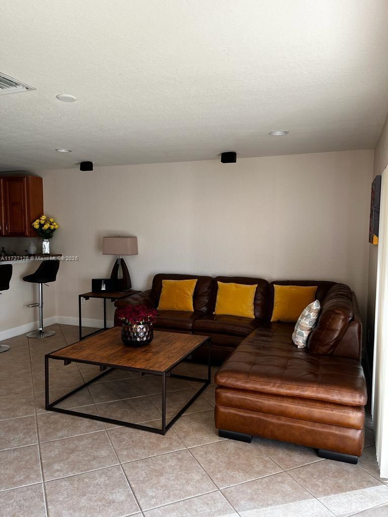 5923 Abbey Road Tamarac, FL 33321 - Photo 3 of 37 a living room with furniture