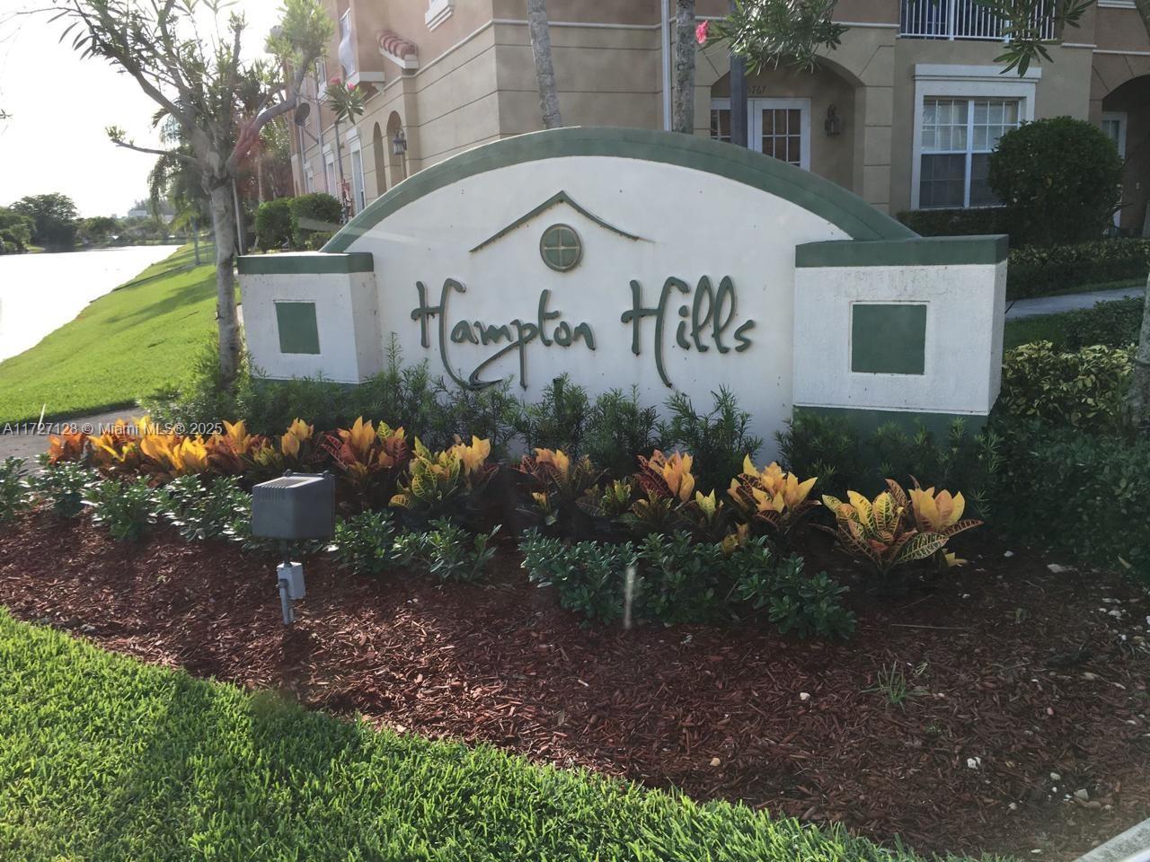 5923 Abbey Road Tamarac, FL 33321 - Photo 31 of 37 a front view of a house with a yard