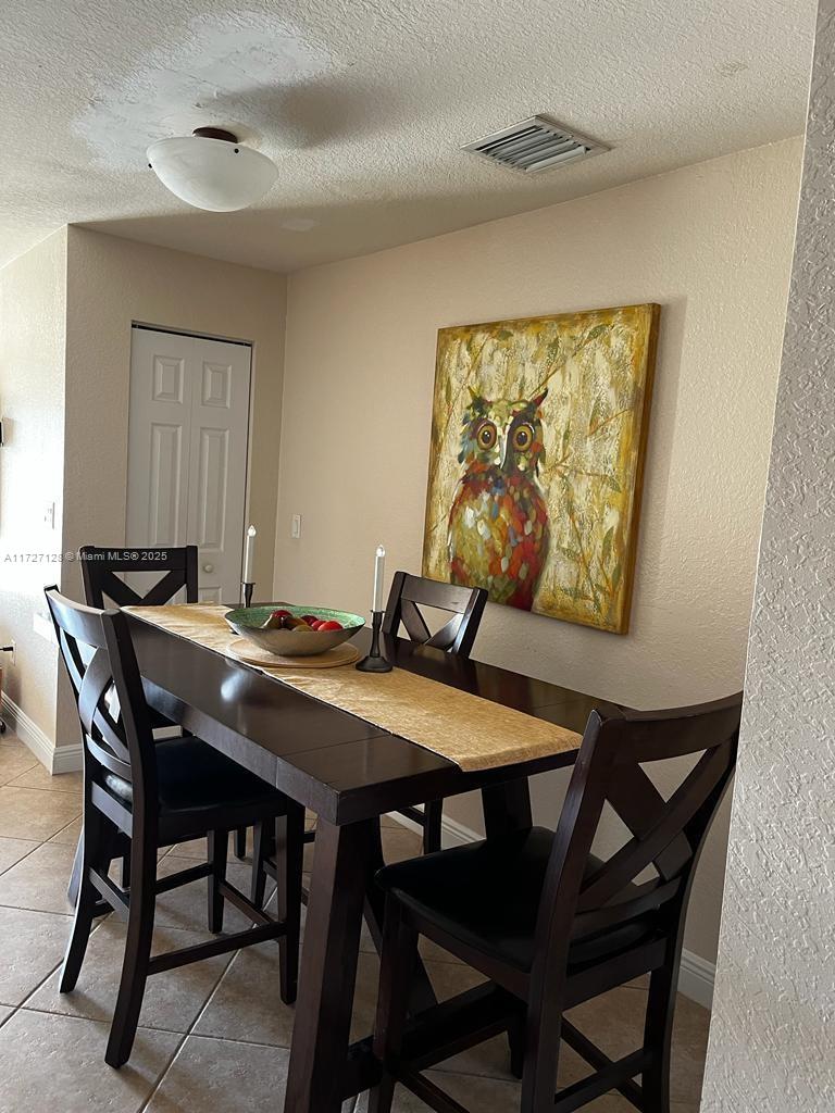 5923 Abbey Road Tamarac, FL 33321 - Photo 8 of 37 a view of a dining room with furniture